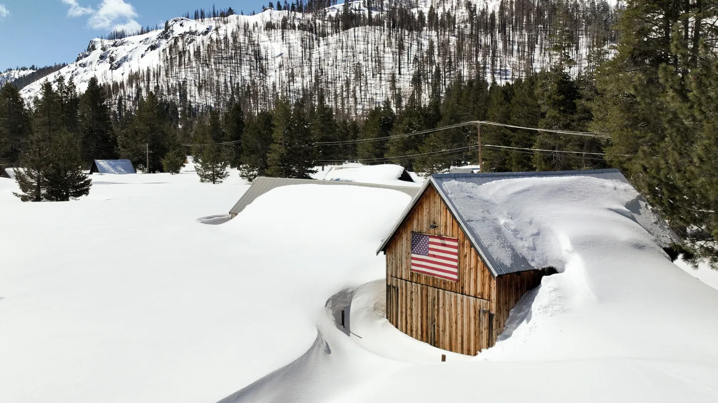 A home covered with snow is located near Lake Tahoe, California, which has seen record levels of snow this winter, March 24, 2023.