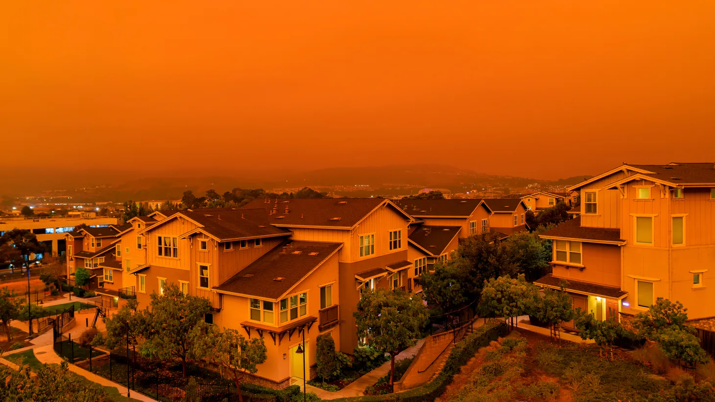 A thick orange haze of ash and smoke — from record wildfires in California — covers a neighborhood in San Francisco on September 9, 2020.