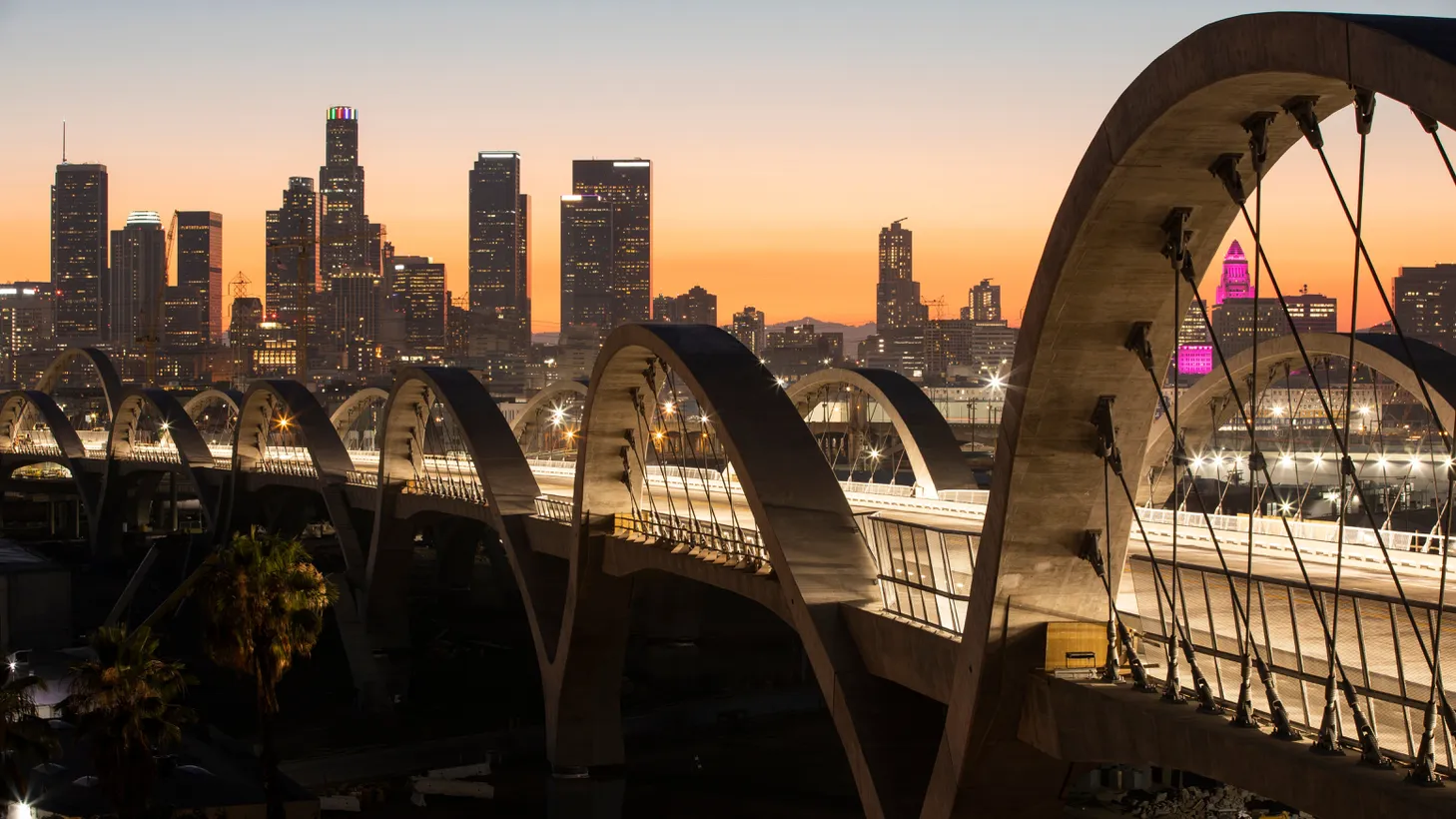 LA’s 6th Street Bridge has been a hit with its stunning views and lit-up archways, and officials were unprepared for Angelenos loving it a little too much, says commentator Joe Mathews.