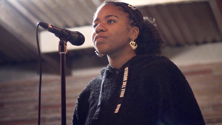 Poetry teacher and performer Aiyana Sha’niel is the youngest graduate of the Community Literature Initiative program.